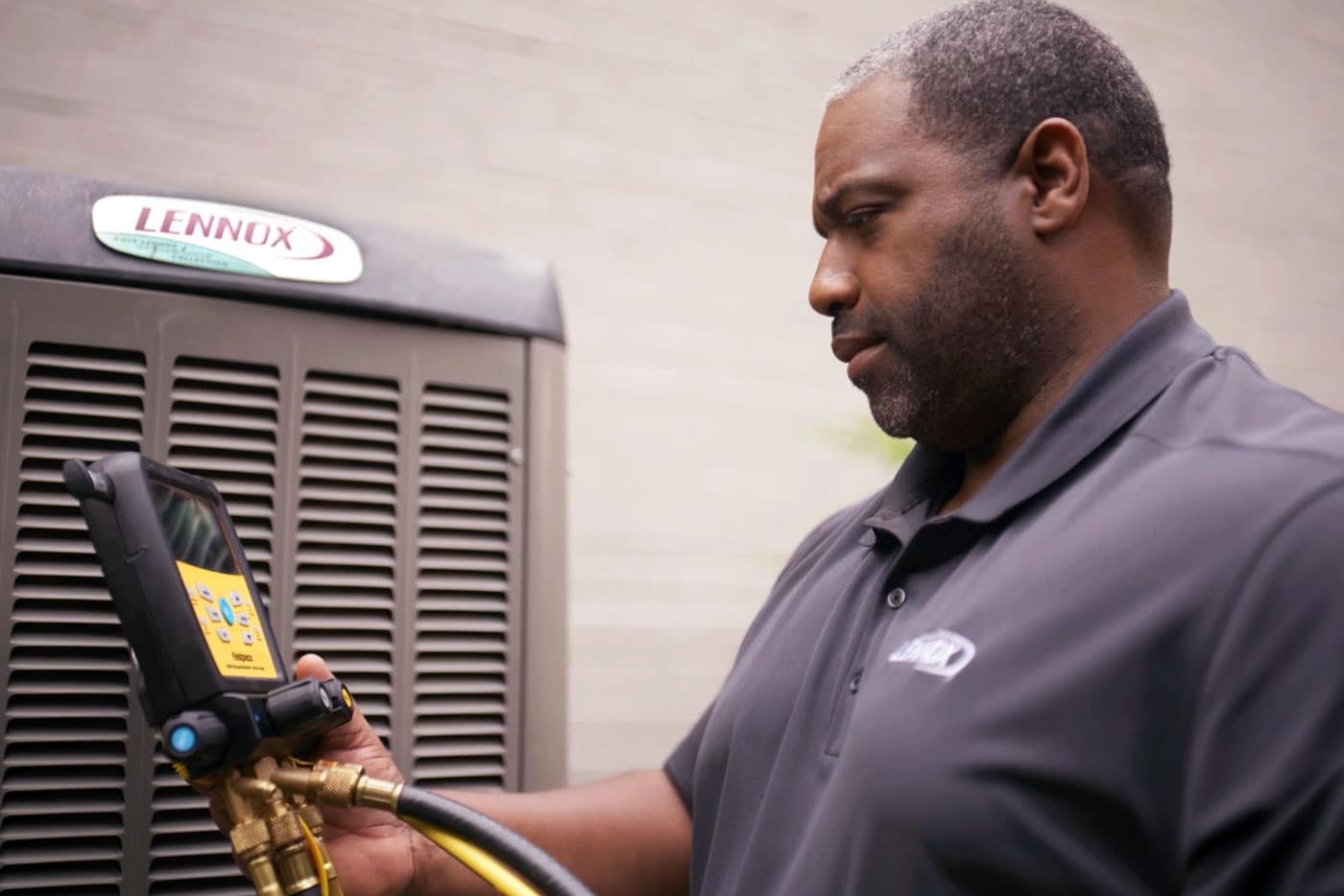 Technician checking heat pump