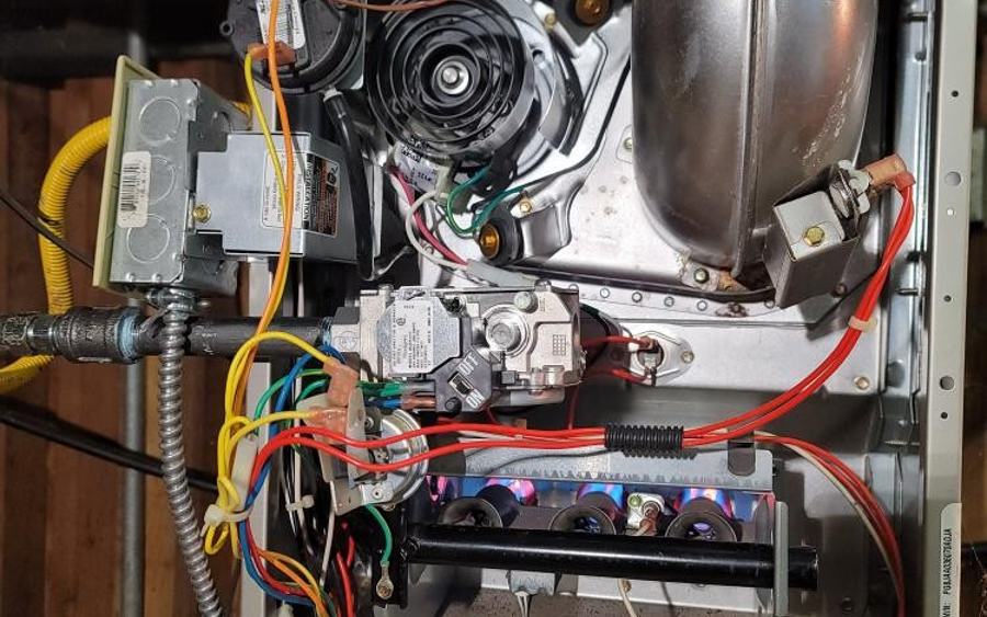 Open furnace cabinet during a Modern Air service visit