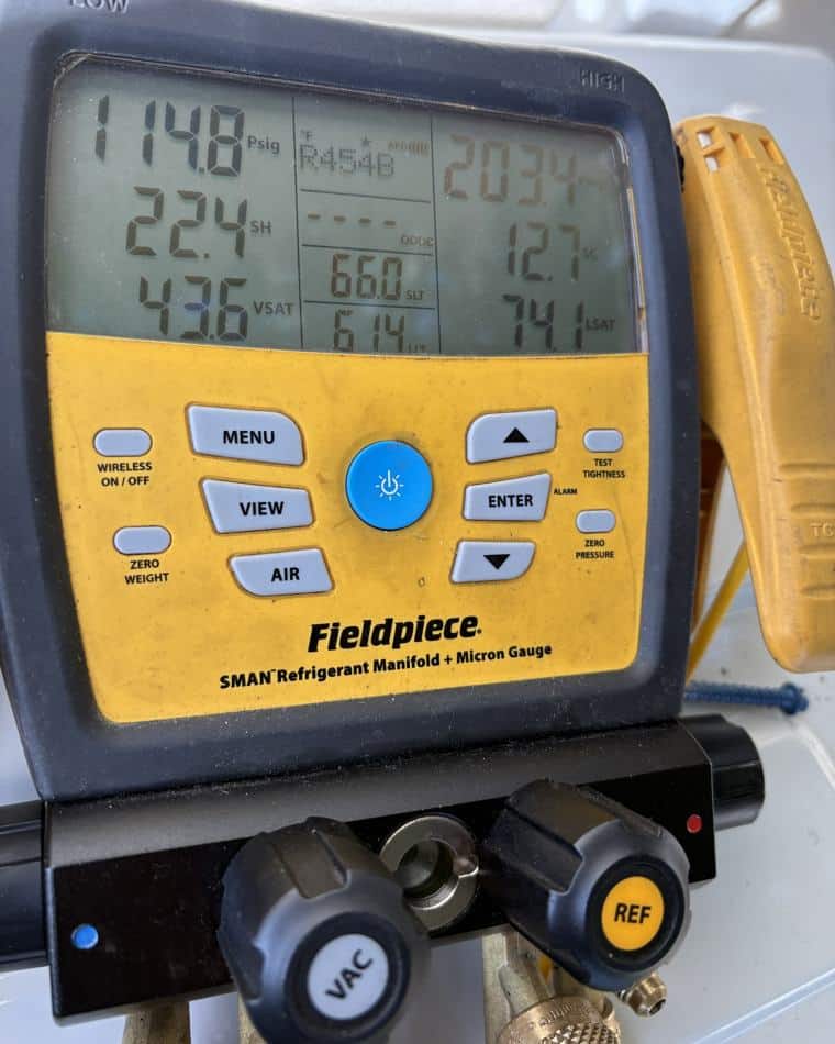 Refrigerant gauges reading a system during a Modern Air HVAC tune-up