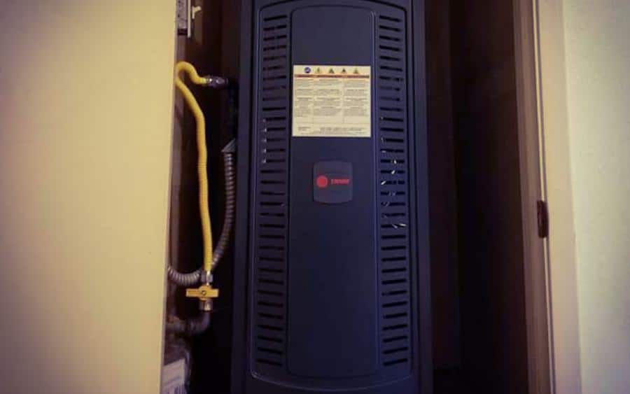 Trane upflow furnace installed in a hallway closet